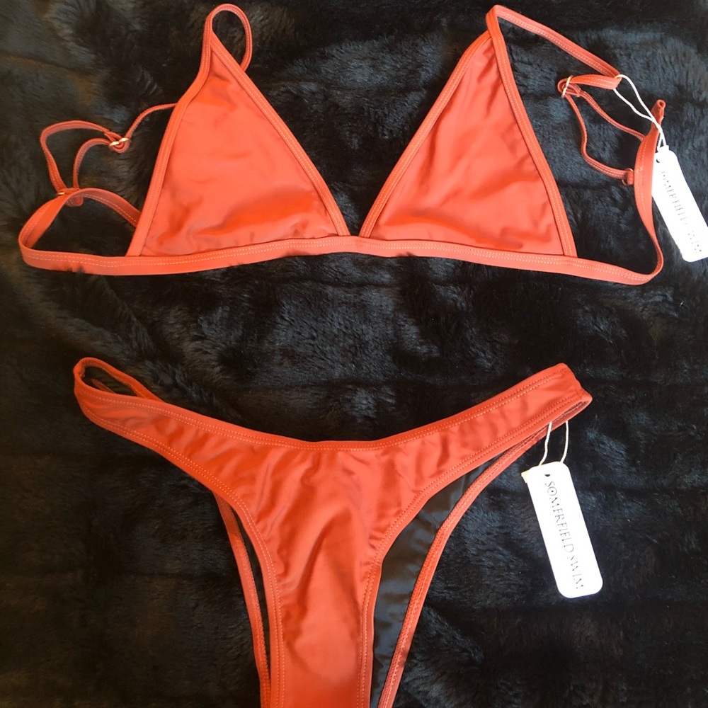 Brand new bathing suit with tags/sanitary sticker!